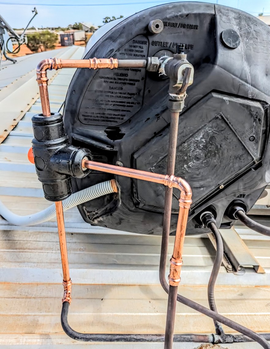 Copper pipe connections on a rooftop hot-water system